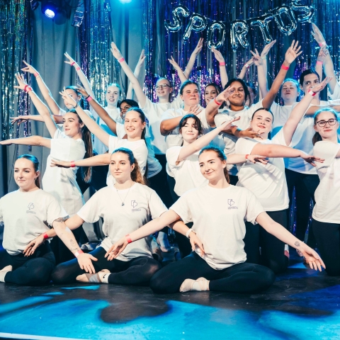 A group of students at the end of a dance performance