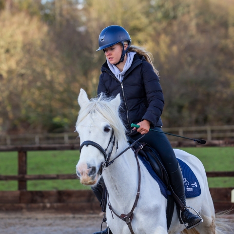 UOP Equestrian member on a white horse