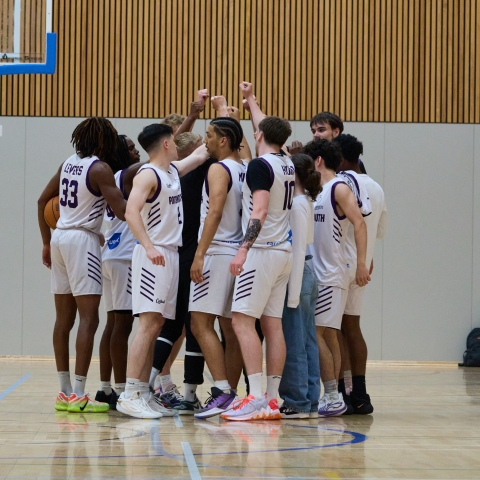 Basketball team huddle before a match