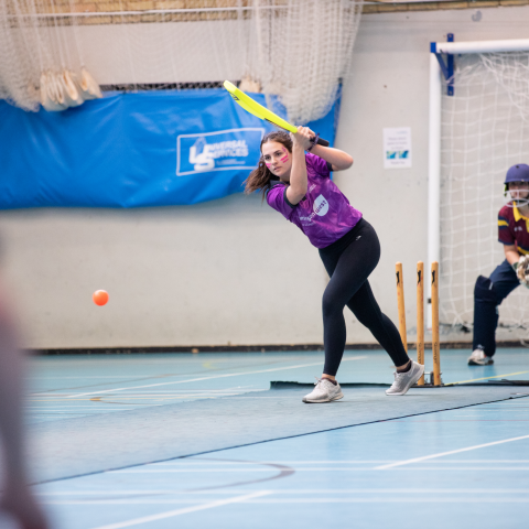 Student striking the ball in a cricket match at Varsity 2025