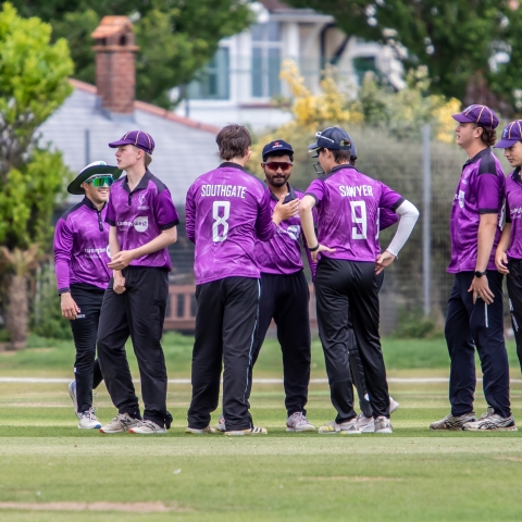 A group of students during a cricket match