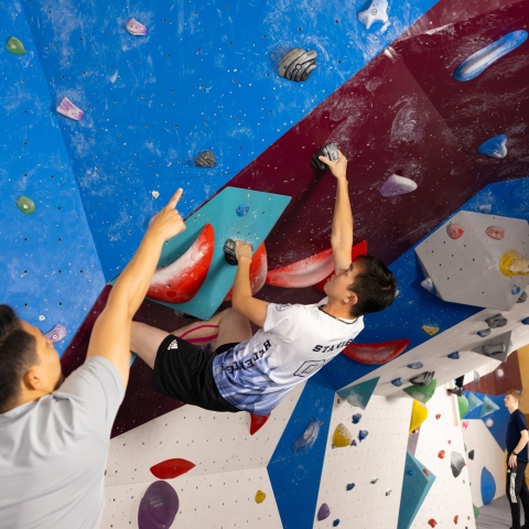 Climber on a bouldering wall