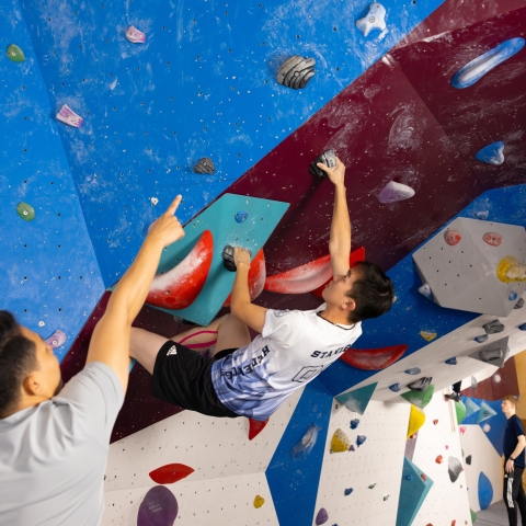 Climber on a bouldering wall