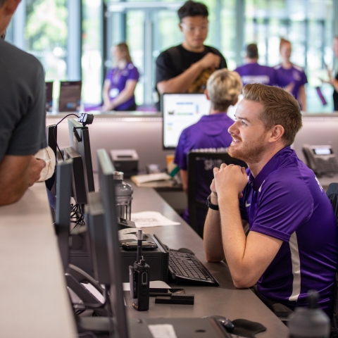 Photo of staff helping visitors with queries at Reception - Ravelin Activities