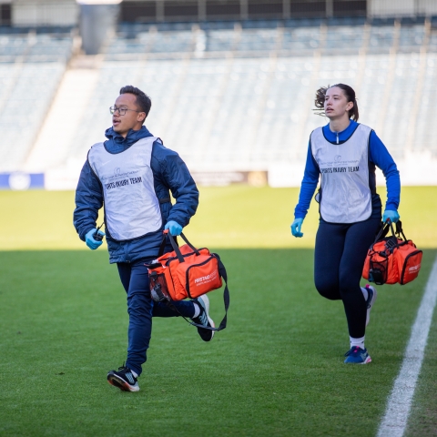 SCRx Physiotherapists running on the pitch