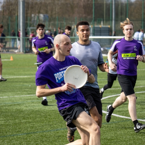 Student competing in Ultimate Frisbee match at Varsity 2025