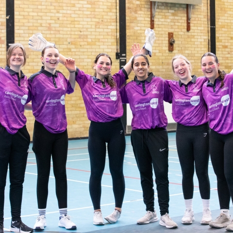Women's Cricket team celebrating at Varsity 2025