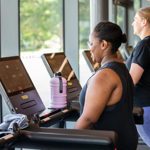 Photo of two women using treadmill machines - Ravelin Activities