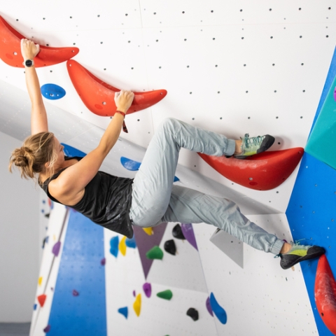 Photo of female visitor using Climbing and Bouldering wall - Ravelin Activities