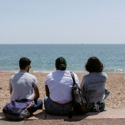  Students sat on southsea beach staring out to see
