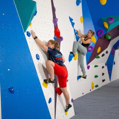 Photo of two visitors using the low ceiling bouldering wall - Ravelin Activities
