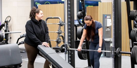 Two young girls working out in the gym
