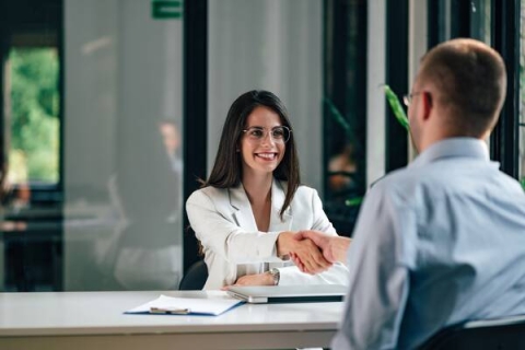 candidate and interviewer shaking hands