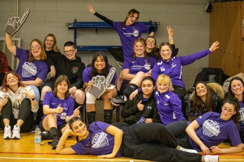 Volleyball spectators cheering on their team