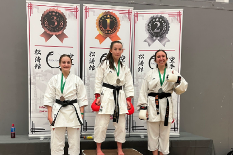 karate scholars on podium