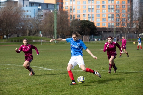 Women football players on a pitch at Varsity