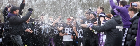 American Football club members celebrating promotion