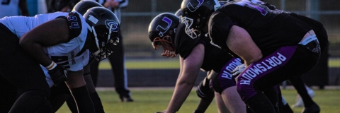 american football team lining up to play