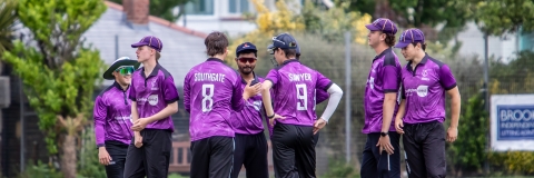 A group of students during a cricket match