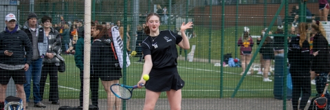 Tennis player returning a serve