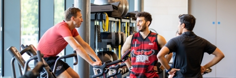 Photo of male visitors talking at bike station of Fitness Suite - Ravelin Activities