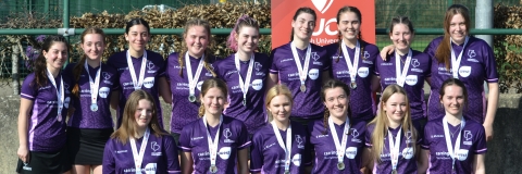 Hockey club women's team with silver medals at Conference Cup finals