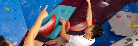 Climber on a bouldering wall