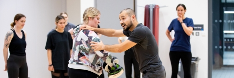 Self defence instructor leading a class in a studio