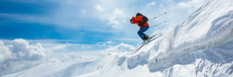 person skiing down mountain