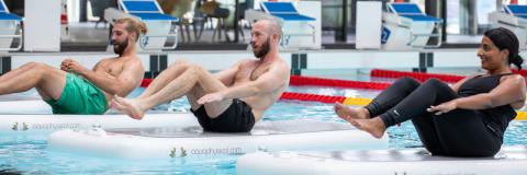 Public enjoying water aerobics class at swimming pool - Ravelin Activities