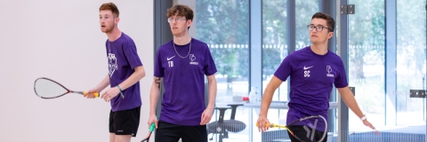 Photo of three students using the squash court - Ravelin Activities