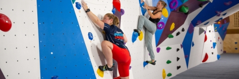 Photo of two visitors using the low ceiling bouldering wall - Ravelin Activities