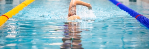 Front photo of Man swimming lengthRavelin Interior