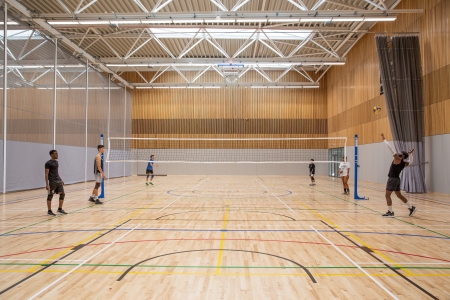 Wide shot of the Volleyball team enjoying the multi purpose court - Ravelin Activities