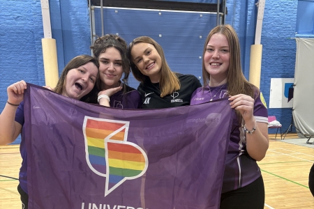 Pride Week - Rugby team holding UOP pride flag