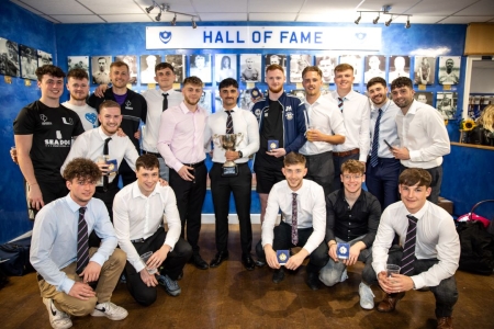Student football team with trophy