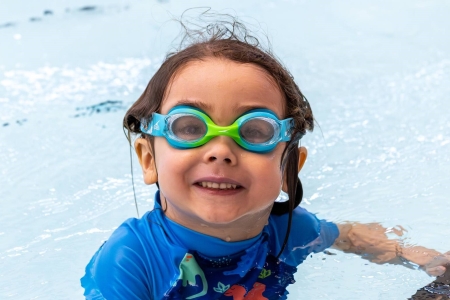 Swimming lessons - little girl in pool