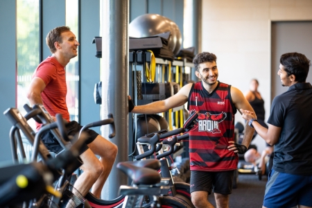 Photo of male visitors talking at bike station of Fitness Suite - Ravelin Activities