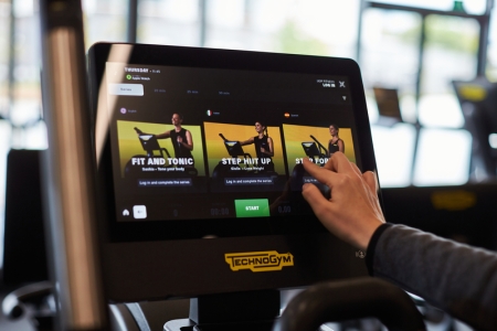 Close up of user setting up step machine with touch screen display
Ravelin Internal Photos