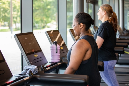 Photo of two women using treadmill machines - Ravelin Activities