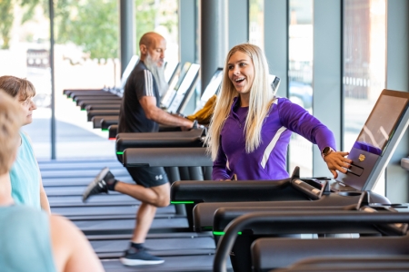 Women receiving induction on how to use fitness suite machines - Ravelin Activities