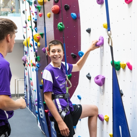Instructor teaches child who to scale the bouldering wall at Ravelin Sport Centre.
Ravelin Sports Event - Children